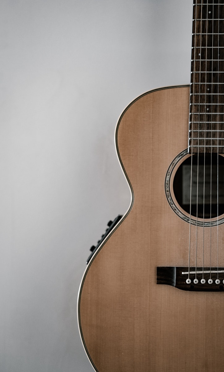 Photo by Annie Spratt brown guitar